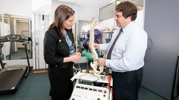  Minister for Small Business Kelly O'Dwyer poses for a photo with business owner, Physiotherapist Andrew Mitchell ahead of the launch of the Shop Small Campaign  which begins on 2 November. 