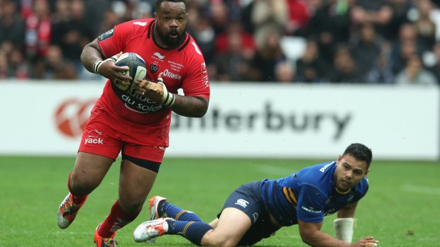 Mathieu Bastareaud of Toulon breaks away from ex-South Sydney player Ben Te'o.