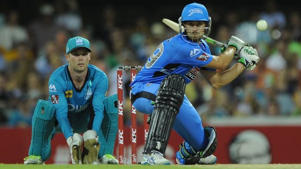 Alex Ross playing a trademark sweep for the Adelaide Strikers against the Brisbane Heat, the team he's set to join this summer. 