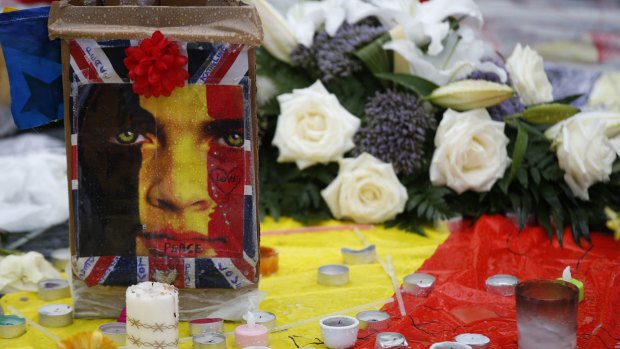 Floral tributes placed to the victims of the attacks in the Belgian capital at the Place de la Bourse in Brussels on Friday.