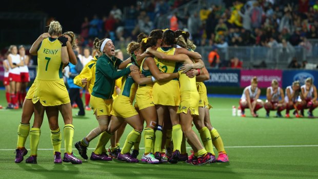 Pleasure and pain: the Hockeyroos celebrate as a distraught England watch on