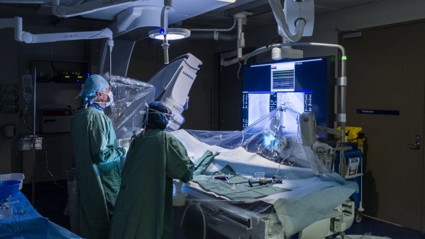 Surgeons work on a patient in Canberra Hospital's new Cardiac Catheterisation Laboratory.