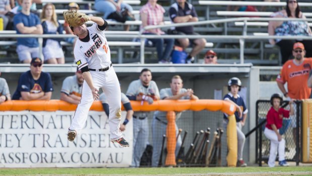 L.B. Dantzler of the Canberra Cavalry make a catch late in the 7th inning to clinch the opening game of a double header for the Calavry.