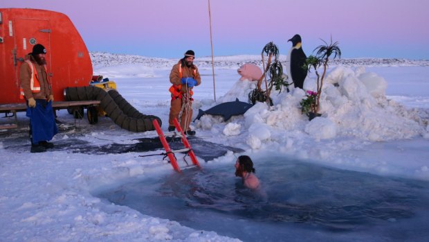 Australians stationed at Antarctica's Davis station celebrate midwinter with an icy dip.