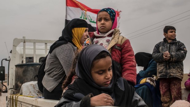 An Iraqi family who fled fighting as government forces advanced into Islamic State-controlled west Mosul on Saturday.