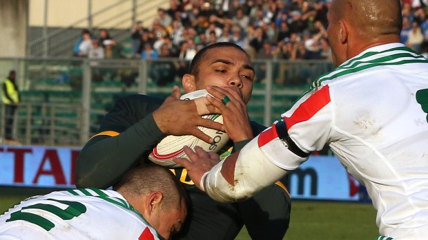 Bryan Habana is crunched in tackle by Luca Morisi.
