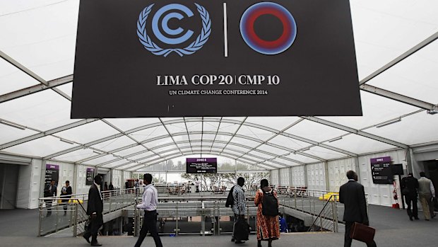 People attend the UN Climate Change Conference COP20 in Lima, Peru.