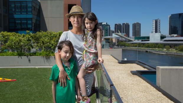 Denise Fung-Henderson, with children Will, 8, and Poppy, 6, is campaigning for a school in the Docklands.
