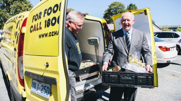 OzHarvest Canberra manager Dave Burnet with Governor General Peter Cosgrove outside the charity's headquarters at St John's Anglican Church in Reid.