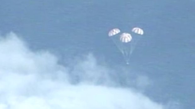 Tough descent: The Orion spacecraft deployed parachutes before splashing down in the Pacific Ocean.
