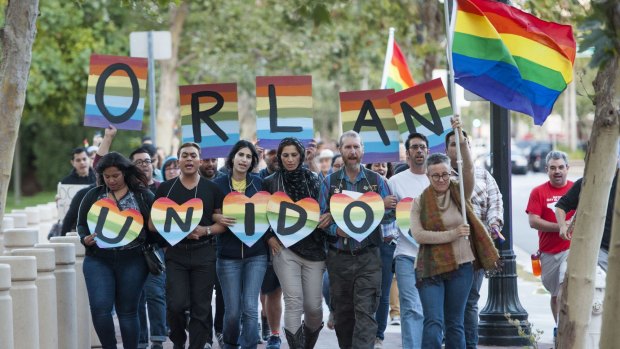 Several hundred gay rights activists march in Santa Ana, California in supports of the victims of the Orlando massacre.