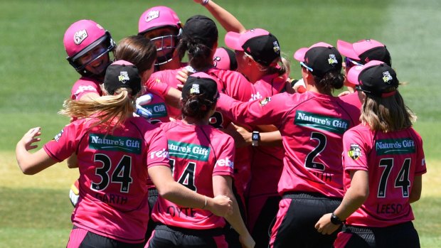 Title moment: The Sydney Sixers celebrate winning after the final of the Women's Big Bash League.