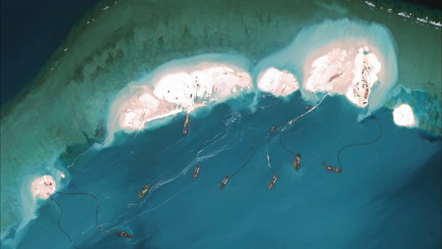 Dredgers working at the northernmost reclamation site of Mischief Reef, part of the Spratly Islands, in the South China Sea in March 2015.