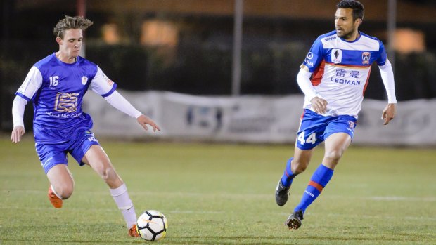 Josh Gulevski [left] playing for Canberra Olympic in a friendly against the Newcastle Jets. Canberra-born Jets skipper Nikolai Topor-Stanley defends.