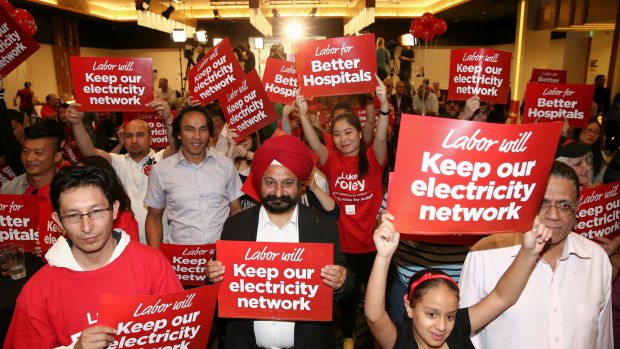 Supporters of Mr Foley wait for his speech at Dooleys Lidcombe Catholic Club.