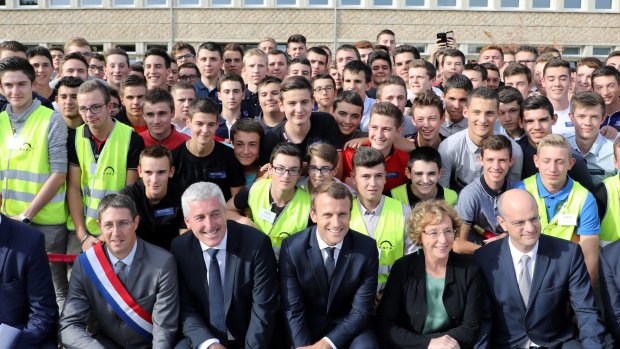 French President Emmanuel Macron, centre, on a visit to a vocational training school earlier this month.