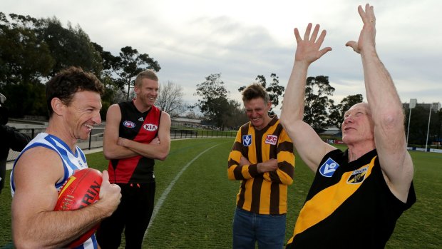 Catch-up: Brent Harvey, Dustin Fletcher and Michael Tuck watch Kevin Bartlett relive one of his big marks.