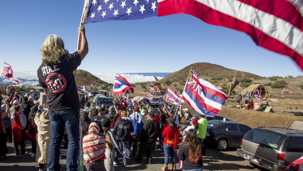 Thirty Metre Telescope protesters stop construction vehicles from driving up to the summit of the mountain.