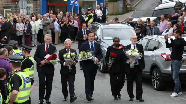 MP Hilary Benn, Speaker of the House of Commons John Bercow, Prime Minister David Cameron, Speaker's chaplain Reverend Rose Hudson-Wilkin and Labour Leader Jeremy Corbyn arrive to pay their respects near to the scene of the murder of Jo Cox.