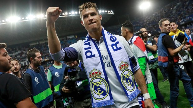 Cristiano Ronaldo celebrates after Real Madrid are crowned La Liga champions.