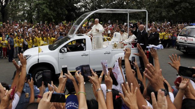 'Santa Papa': Huge crowds turn out to greet Pope Francis in Manila.