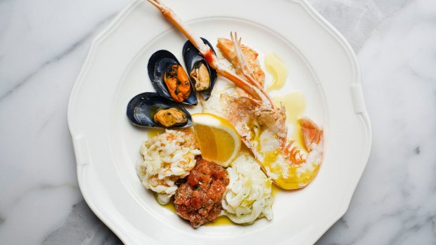 Seafood antipasto of raw and cooked scampi, crab, squid, prawns and mussels.