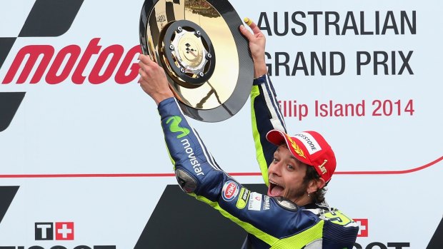Valentino Rossi holds up his trophy.