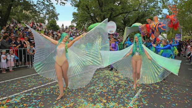 Performers take part in the Moomba Festival parade.