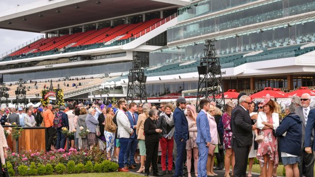 Queues begin early at Flemington Racecourse to nab a great position on the lawn.