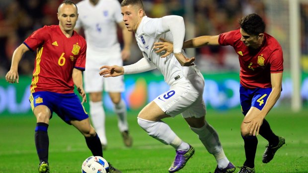Clash of cultures: England's Ross Barkley tries to break down the Spanish defence.