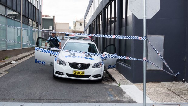 Police guard the laneway where the two boys were arrested in October.