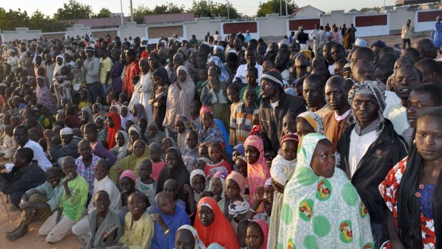 Displaced people from Baga listen to Nigerian President Goodluck Jonathan in a Maiduguri camp.