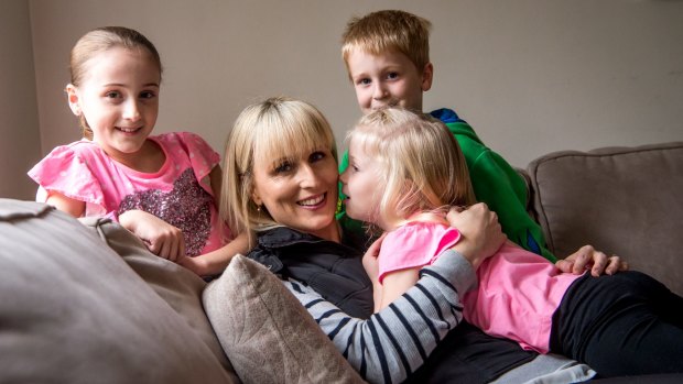 Kylie Gellie, who has had a mastectomy and oophorectomy to avoid breast and ovarian cancer, with her children Jasmine, Korby and Sienna. 
