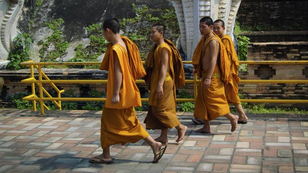 Monks walking in Chiang Mai.
