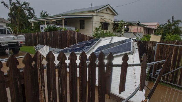 A lost roof lands in the neighbour's garden in Bowen.