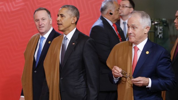 Then US president Barack Obama with former New Zealand Prime Minister John Key and Australia's Malcolm Turnbull prepare for the group photo at last year's APEC meeting in Peru.