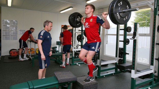 Paul Stridgeon observes England centre Owen Farrell during a Lions gym session on the 2013 tour of Australia.