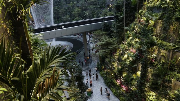 People walk through the Forest Valley garden at Jewel Changi Airport prior to its opening last year in Singapore.