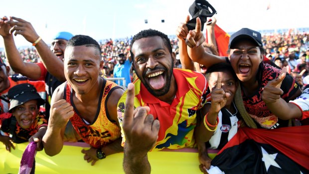 Fan-tastic: Papua New Guinea supporters celebrate victory.