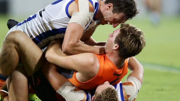 Double-teamed: Giants Toby Greene gets to grips with North's Sam Wright.
