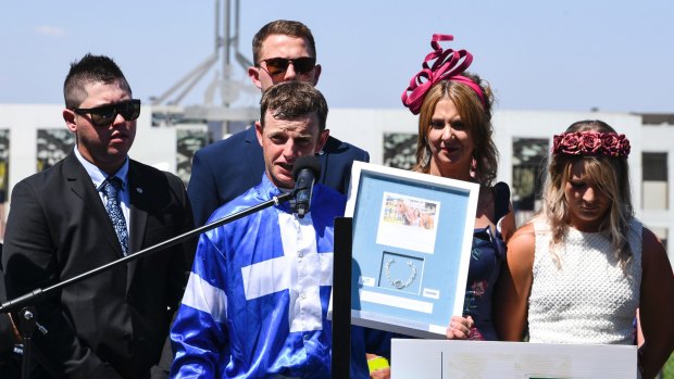 Jockey Richard Bensley (centre) and members of the family of the late Riharna Thomson react during the trophy ceremony for the inaugural Riharna Thomson Bracelet.