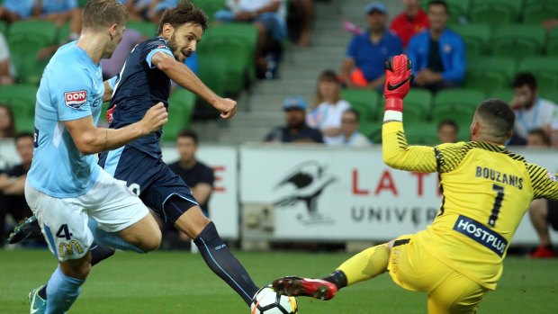 Target practice: Milos Ninkovic takes a shot at goal during a busy night for Dean Bouzanis.