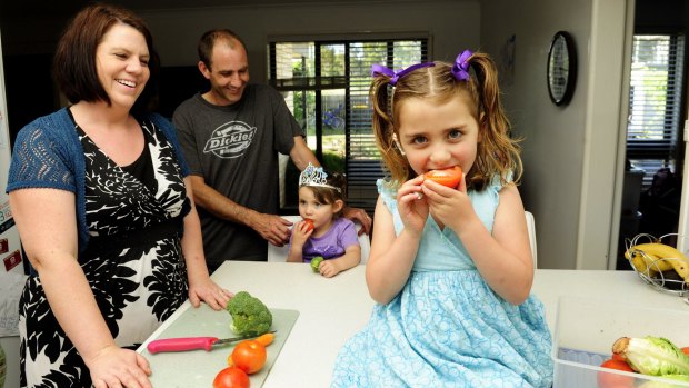 The Harvey family, from left, Ngaire, Chris, Imogen, 3, and Aisha, 5, at home in Kambah. They encourage their children to eat vegetables.