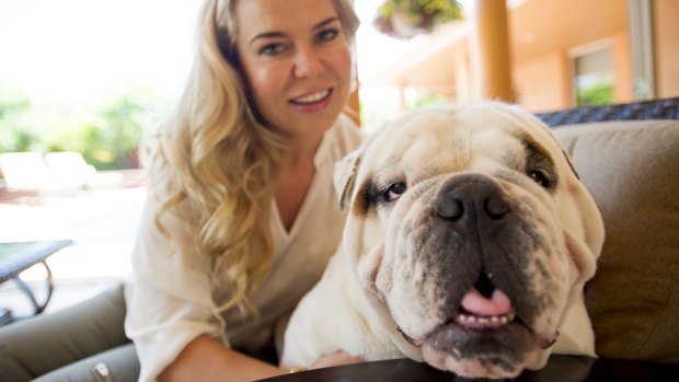 English Cross Australian Bulldog Max and his owner Magdalena Montalvo. "Max" is the most popular ACT dog name this century.
