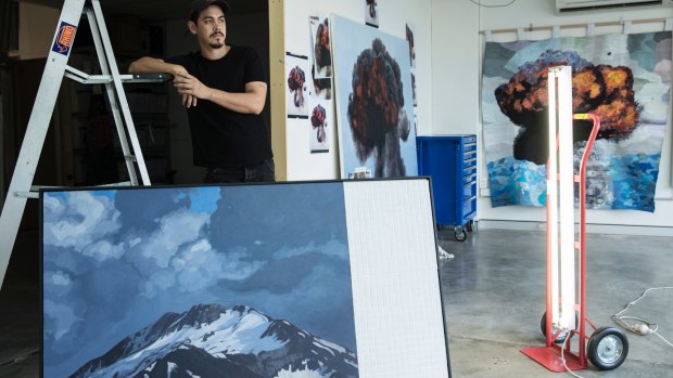 Abdul Abdullah with his work, View From Manus II, part of the All We Can't See exhibition.
