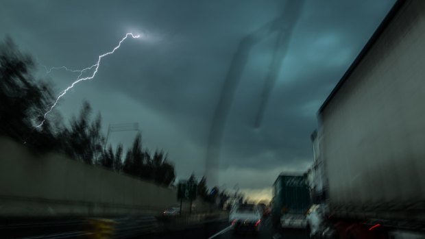 A line of fast moving thunderstorms tracks over Horsley Park in Sydney's west.  