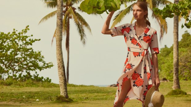 A campaign image from Net-a-Porter's Jet-a-Porter capsule collections, featuring a holiday-ready dress from Ganni. 