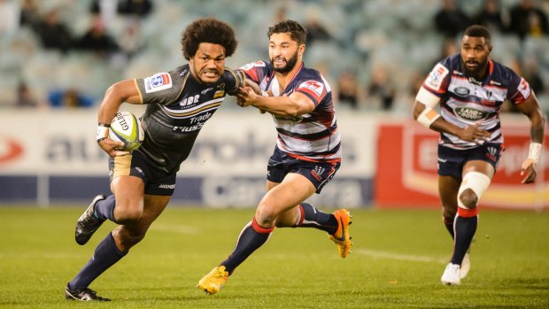 Brumbies wing Henry Speight makes a charge down the line.