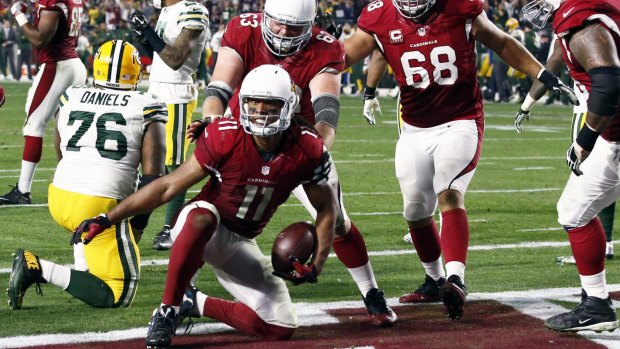 Golden moment: Larry Fitzgerald celebrates the game-winning touchdown.