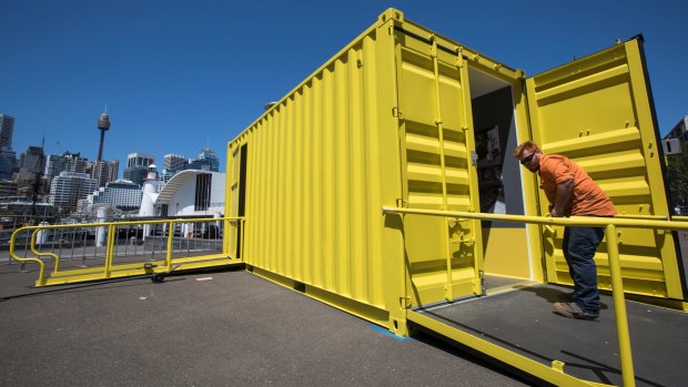 The final touches are made to Containers, a new exhibition housed entirely in six 20-foot shipping containers at the Australian National Maritime Museum.